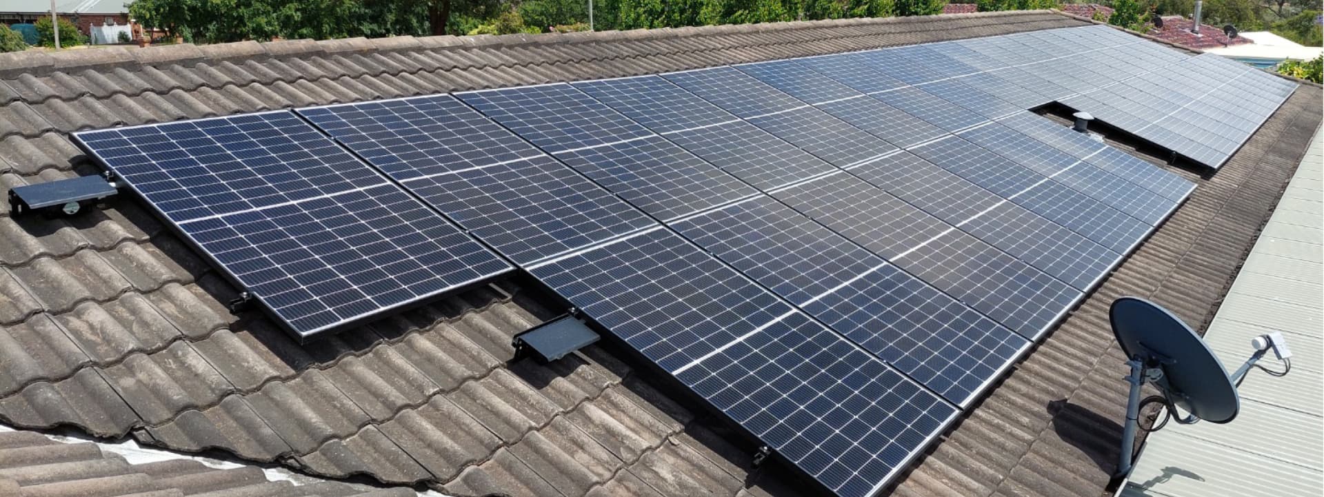 Split view of Fronius Primo inverters and aerial solar shed installation
